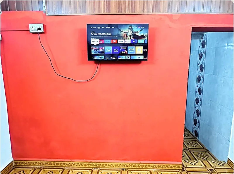 Room 1 Android TV on the orange wall